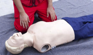 Practising CPR using dummy.